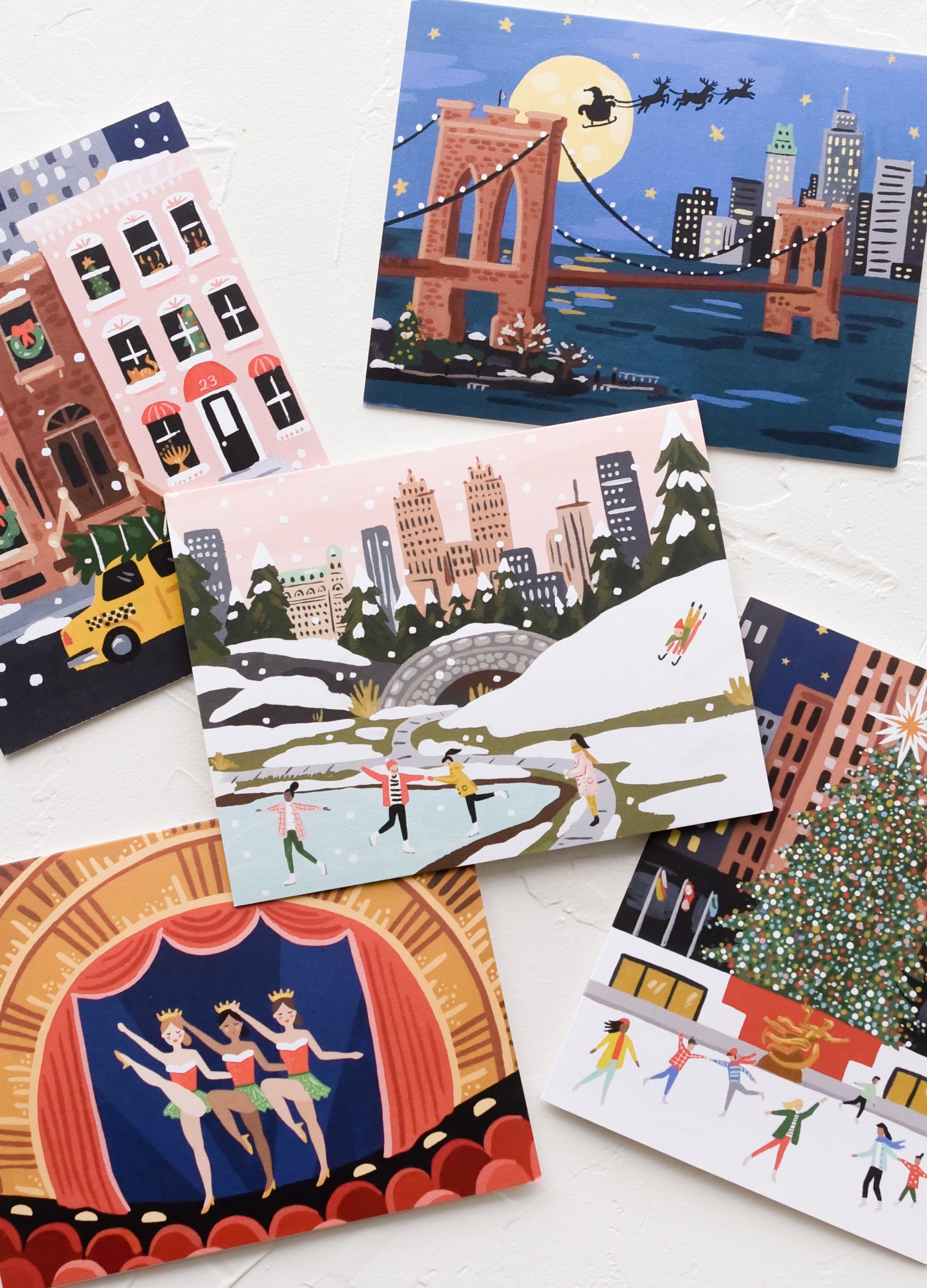 An illustrated card set with different holiday NYC scenes.