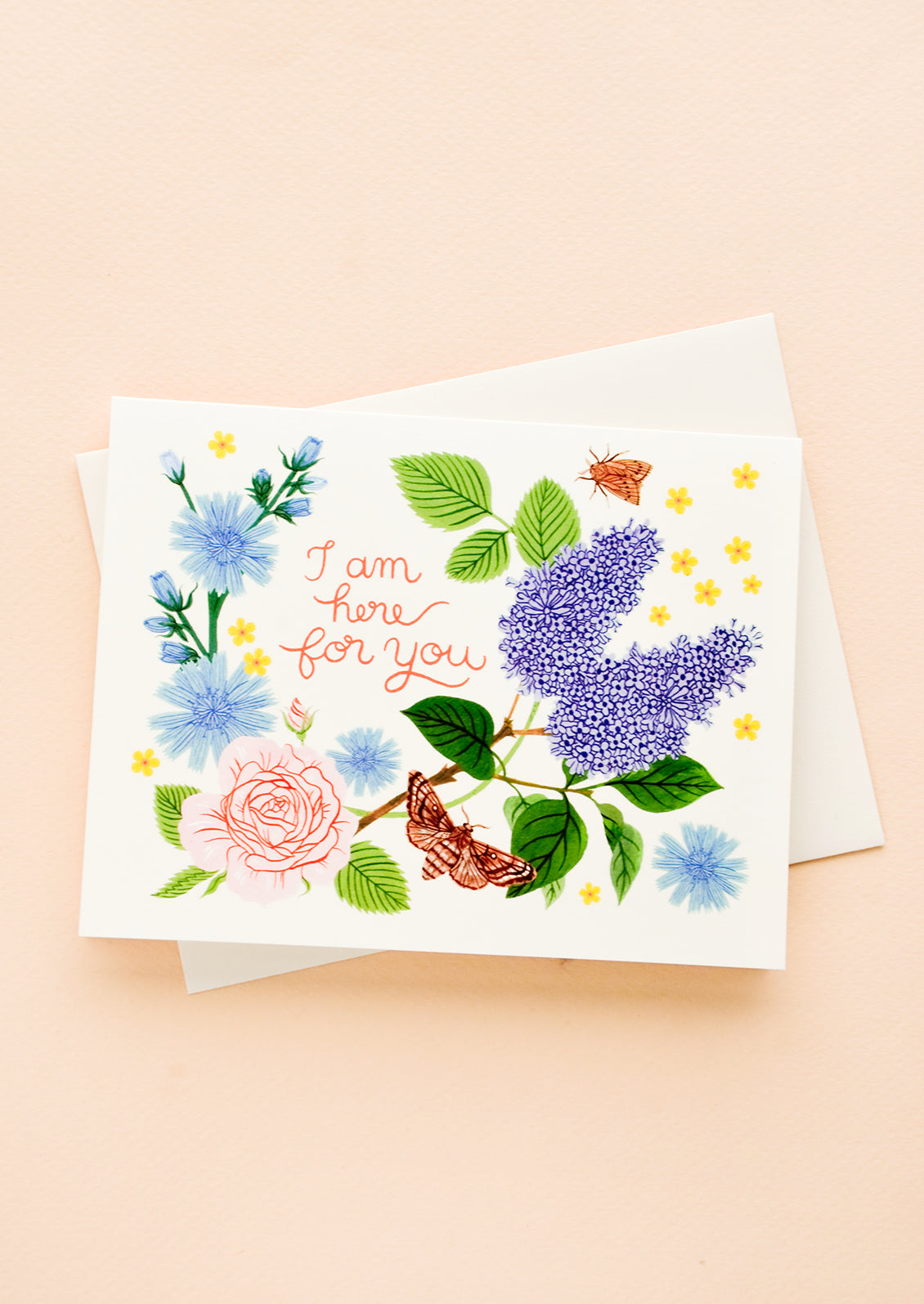 Greeting card with garden florals and bugs, red cursive text reads "I am here for you"