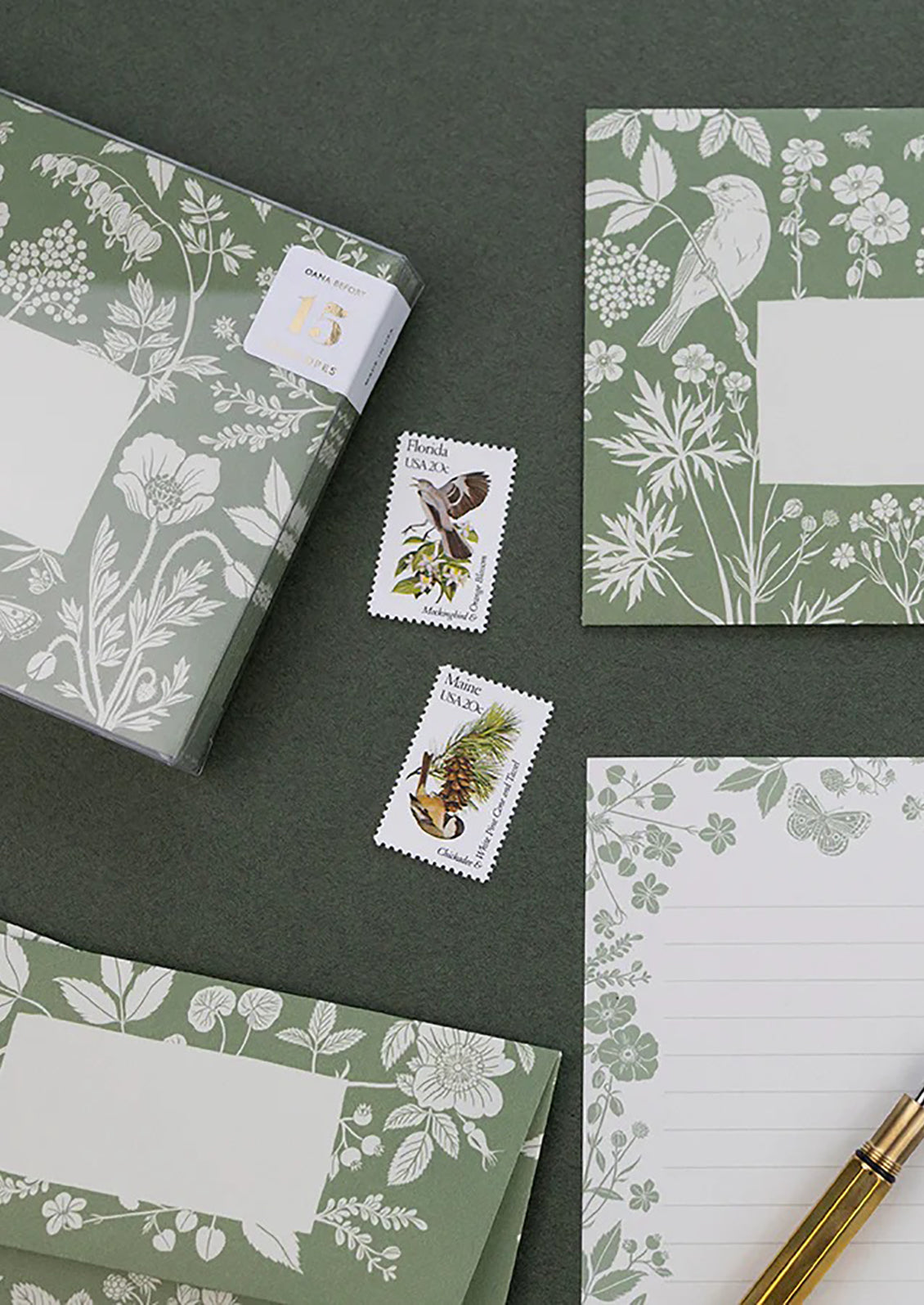 A green and white stationery scene.