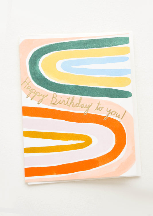 Birthday card with painted sideways rainbows in bright colors