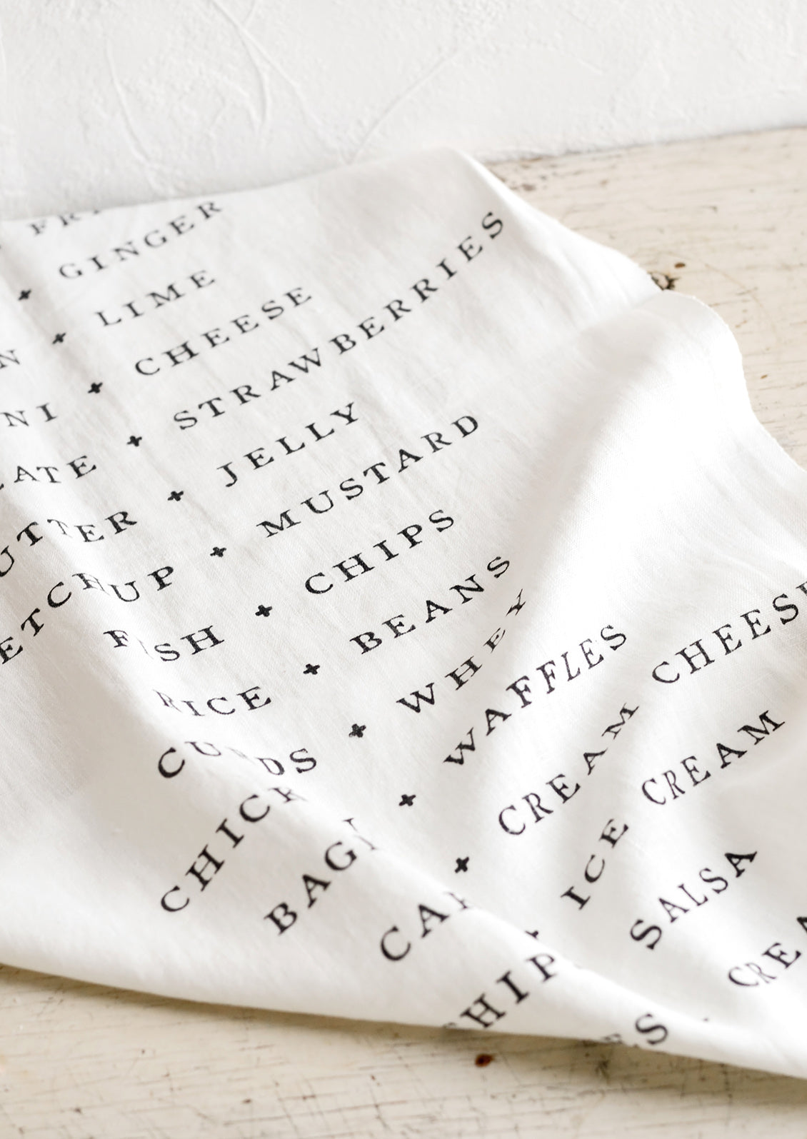 A white table runner with names of food pairings listed opposite each other.