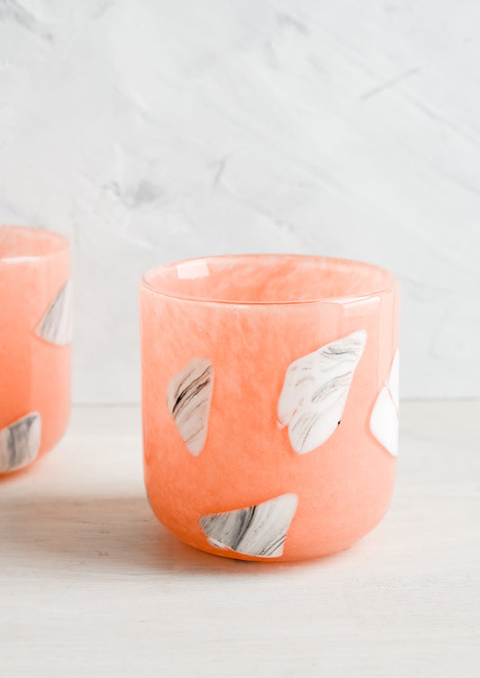 Peach glass cups with white and grey inlay pattern.