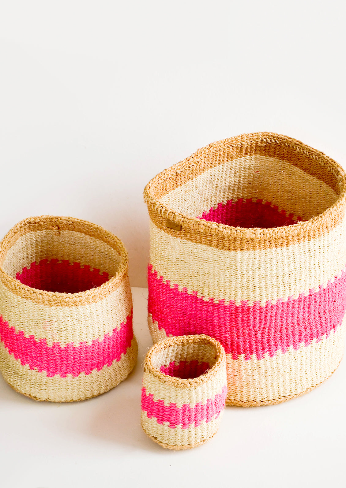 Set of woven sisal baskets in incremental sizes