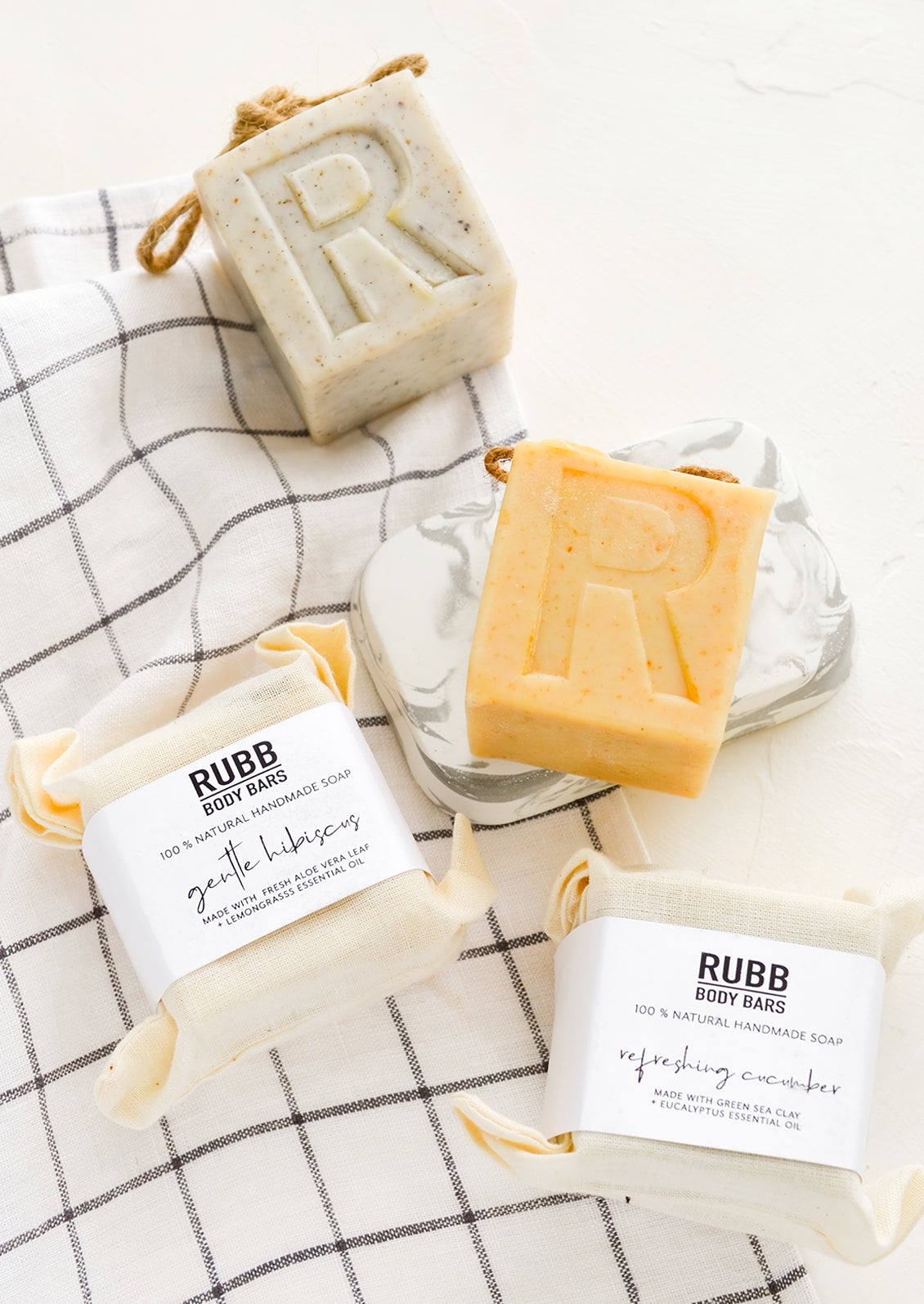 Cube shaped soap bars with embedded rope at top.