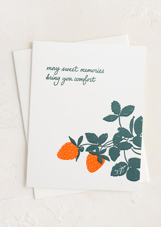 A greeting card with strawberry print and text reading "May sweet memories bring you comfort".