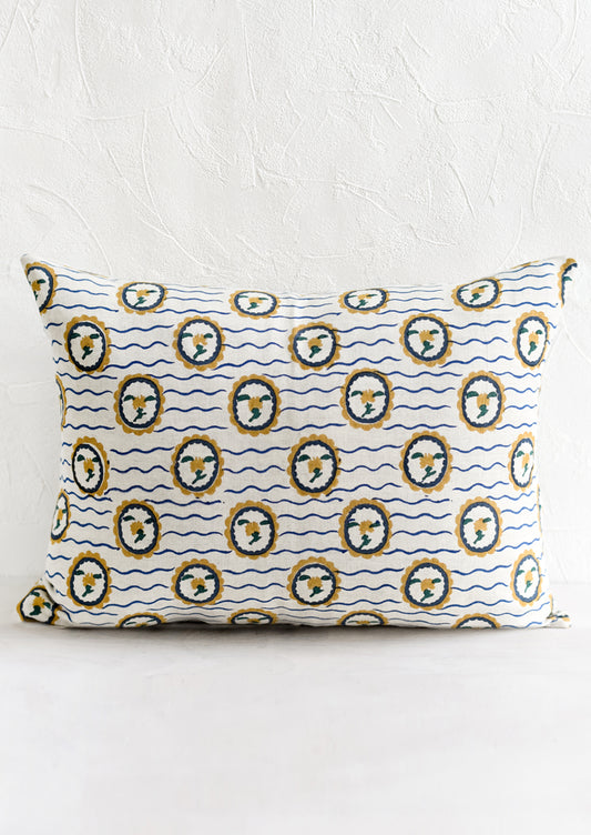 A block printed pillow with wavy floral motif.