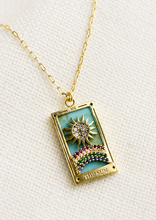 A necklace in style of Sun tarot card.