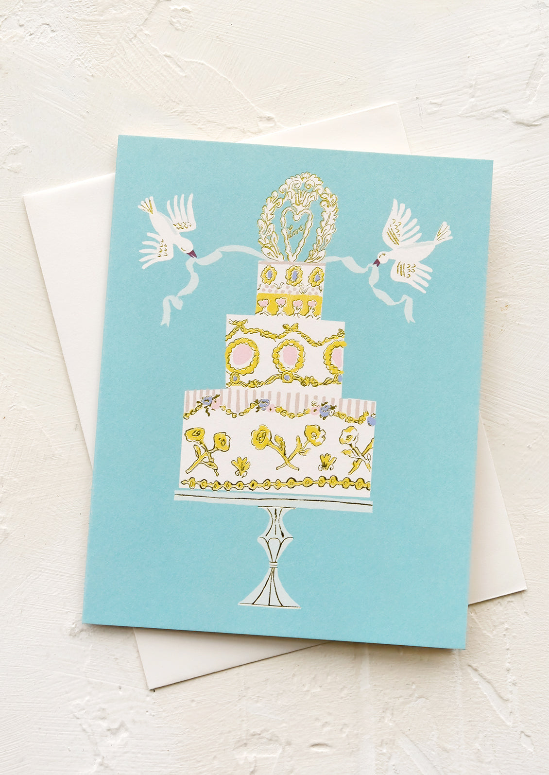 A greeting card with illustration of wedding cake with doves.