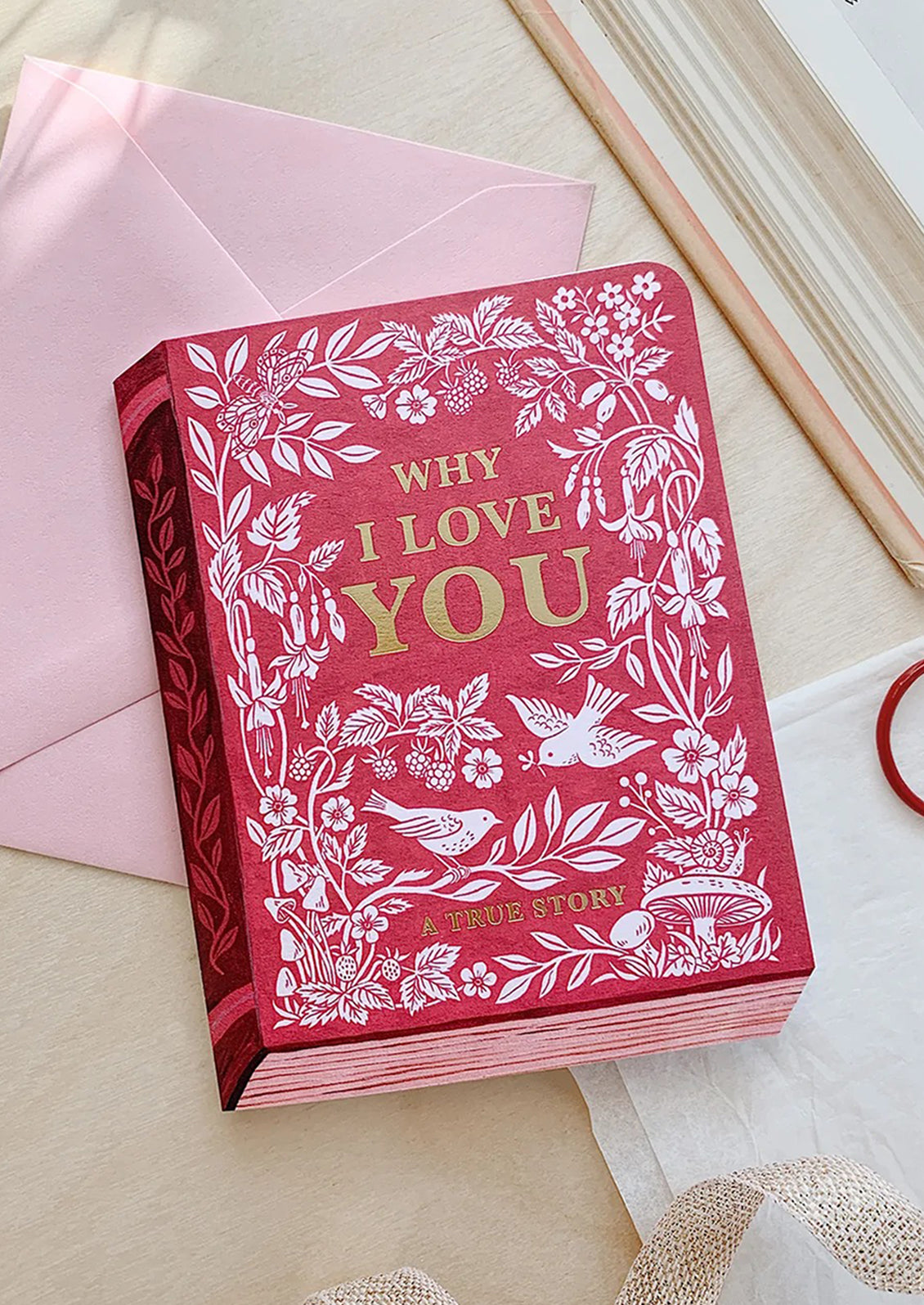 A card made to look like a book, reading "Why I love you — a true story".