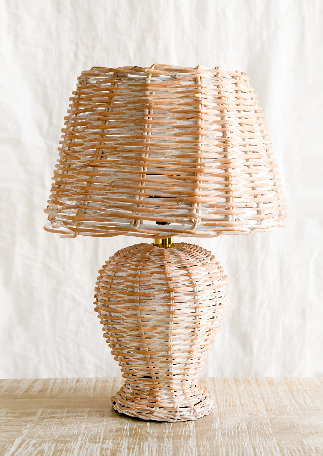 A woven wicker table lamp.