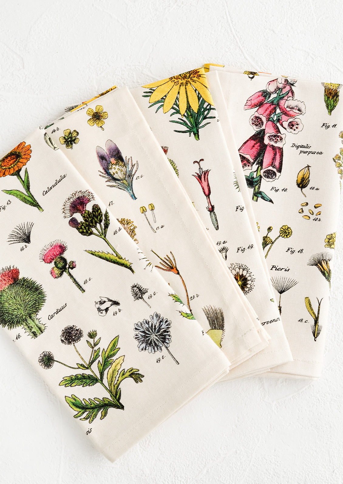 A set of four cotton napkins with colorful botanical wildflower print.